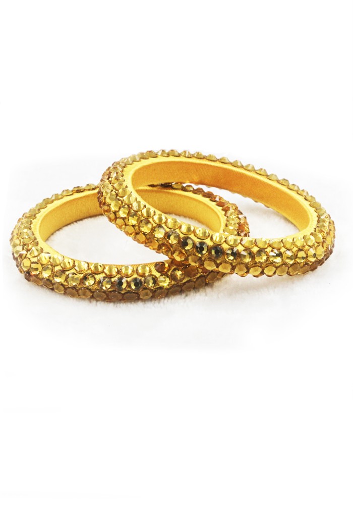 Luminous gold yellow crystal bangles.