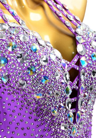 This dazzling purple dance dress is perfect for Cha-Cha, Salsa, Rumba, and other Latin rhythms. The intricate beading and asymm