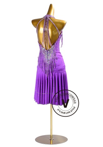 This dazzling purple dance dress is perfect for Cha-Cha, Salsa, Rumba, and other Latin rhythms. The intricate beading and asymm