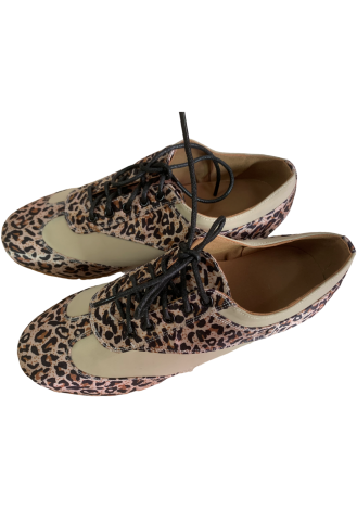 Stylish women\'s ballroom dance shoes with a leopard print detail.