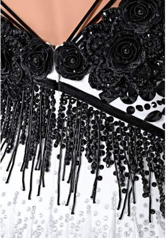 Stunning black and white Latin dance dress with feather skirt and beaded details.