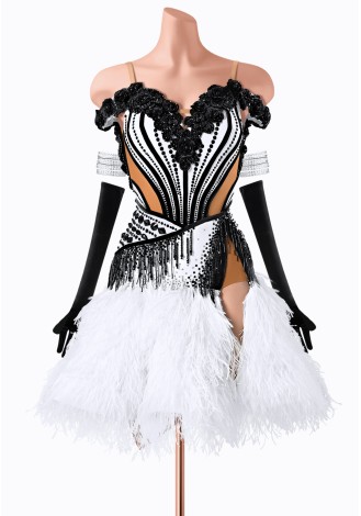 Stunning black and white Latin dance dress with feather skirt and beaded details.