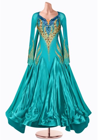 This stunning teal ballroom dance gown features a dazzling jeweled bodice and flowing skirt, perfect for your next competition.