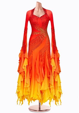 A stunning ombre ballroom dance gown in shades of red, orange, and yellow. The intricate detailing and flowing skirt make it pe