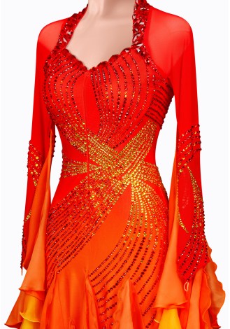 A stunning ombre ballroom dance gown in shades of red, orange, and yellow. The intricate detailing and flowing skirt make it pe