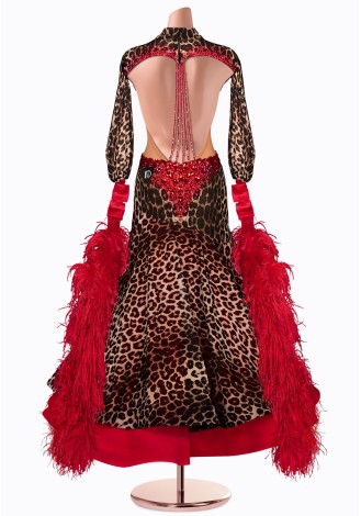 A stunning ballroom dance gown in a leopard print with red accents and feather details.