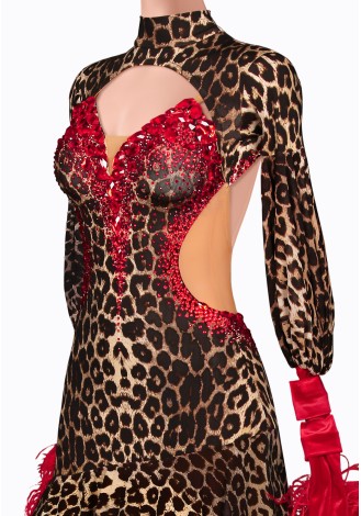 A stunning ballroom dance gown in a leopard print with red accents and feather details.