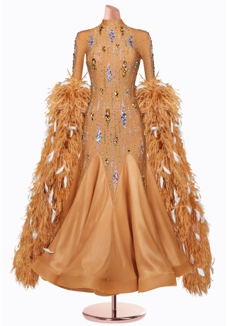 A stunning ballroom dance gown in a warm, sandy hue.  The bodice is adorned with sparkling embellishments and the long sleeves f