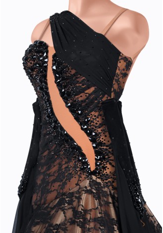 Elegant black and champagne ballroom dance gown with feather detailing.