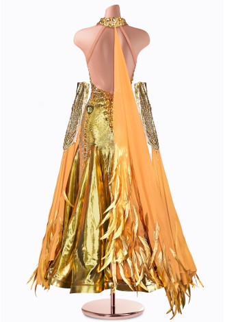 Shine bright on the dance floor in this stunning gold ballroom gown. The intricate beading and shimmering fabric create a breat