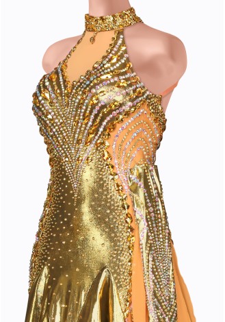 Shine bright on the dance floor in this stunning gold ballroom gown. The intricate beading and shimmering fabric create a breat