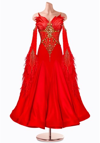 A stunning red ballroom dance gown adorned with gold embellishments and red feather accents.