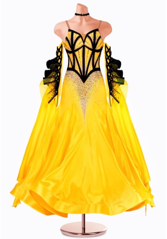 Shine bright in this stunning yellow ballroom dance gown. The black bodice and dramatic sleeves add a touch of elegance.