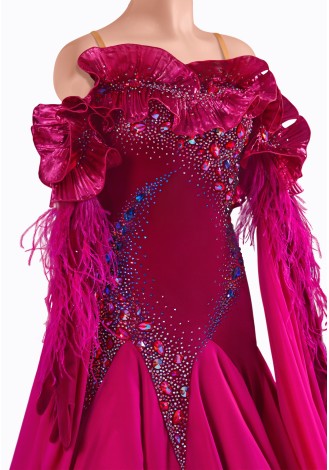 A dazzling fuchsia ballroom dance gown, adorned with feathers and shimmering crystals. The off-the-shoulder design and flowing 