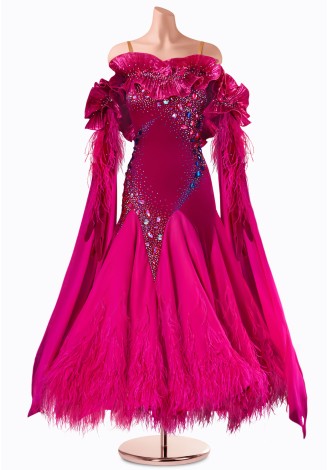 A dazzling fuchsia ballroom dance gown, adorned with feathers and shimmering crystals. The off-the-shoulder design and flowing 