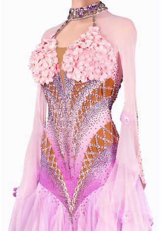 A breathtaking lavender ballroom dance gown adorned with delicate pink floral accents. The intricate design and flowing skirt c
