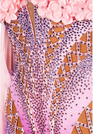 A breathtaking lavender ballroom dance gown adorned with delicate pink floral accents. The intricate design and flowing skirt c