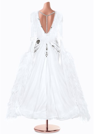 A stunning white ballroom dance gown with intricate beading and feather accents. The elegant design is perfect for a graceful p