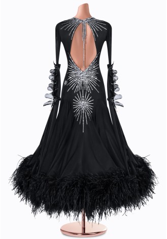 Elegant black ballroom dance gown with silver embellishments and feather trim.