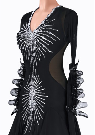 Elegant black ballroom dance gown with silver embellishments and feather trim.