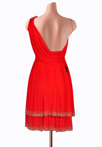 This stunning red Latin dance dress is embellished with gold detailing and crystals. A perfect choice for competition.