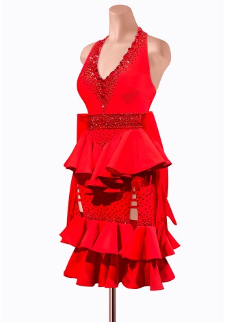 This fiery red Latin dance dress is adorned with dazzling rhinestones and features a stunning peplum waist and ruffled skirt. P